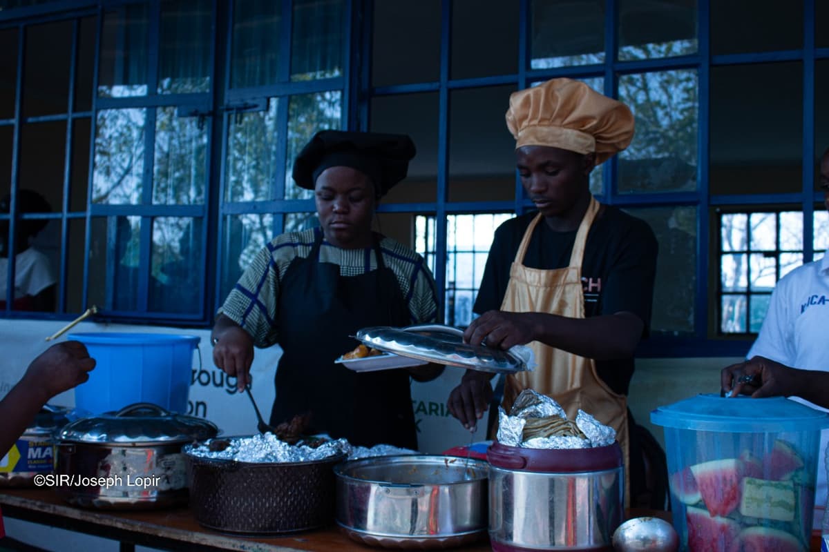 Serving food in Kakuma